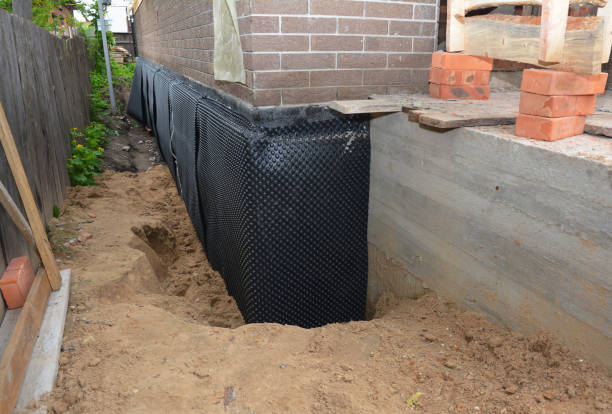 SJ Waterproofing Pros technician performing targeted Exterior Waterproofing assessment in Millstone Township, NJ